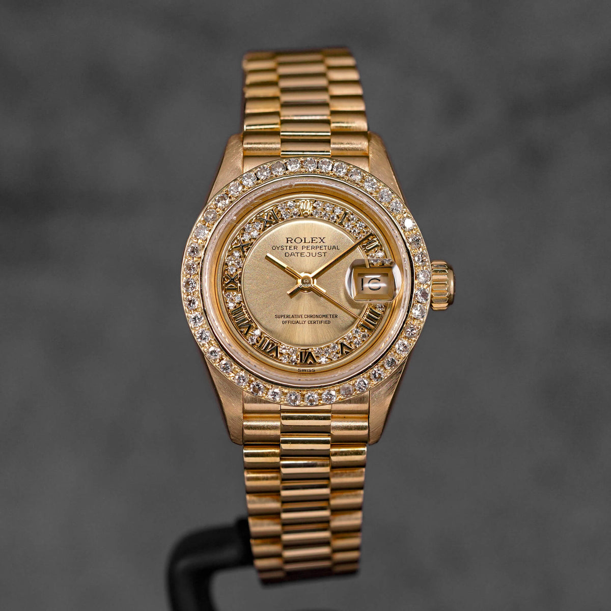 DATEJUST 26MM YELLOWGOLD CHAMPAGNE ROMAN DIAMOND DIAL DIAMOND BEZEL (WATCH ONLY)