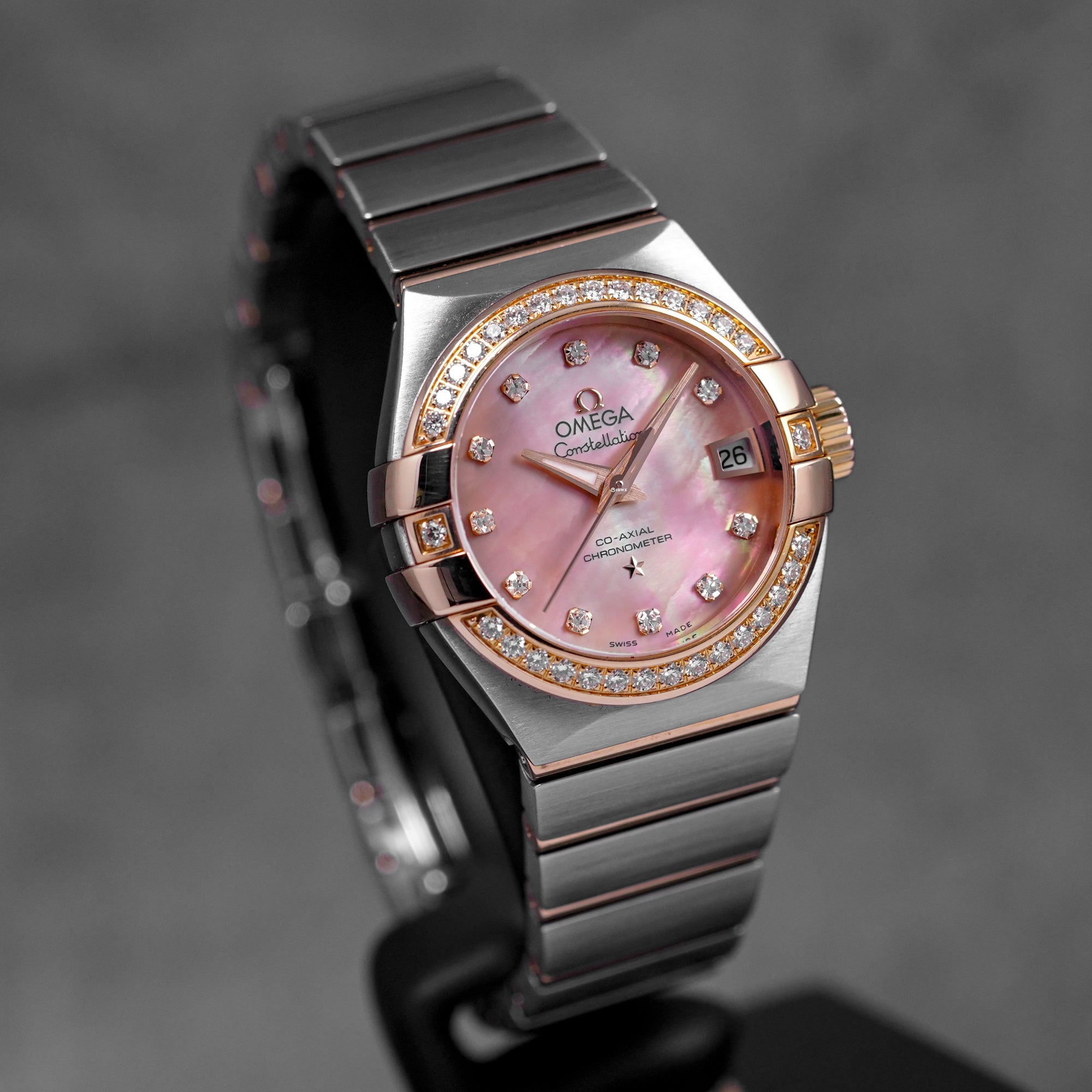 harga omega constellation rosegold mop