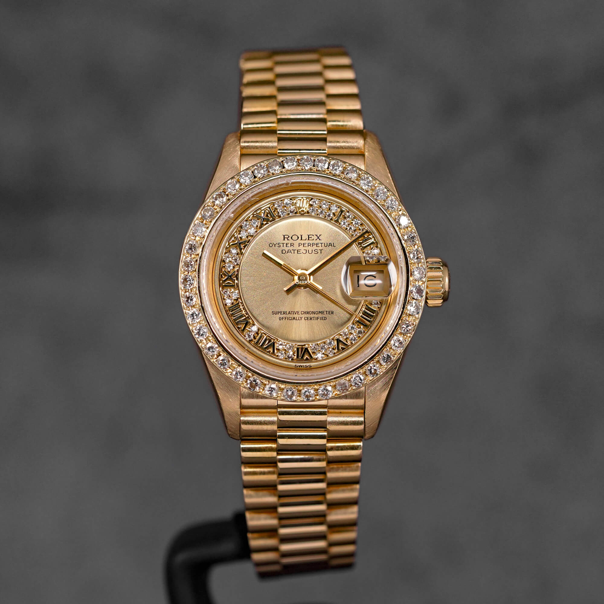 DATEJUST 26MM YELLOWGOLD CHAMPAGNE ROMAN DIAMOND DIAL DIAMOND BEZEL (WATCH ONLY)