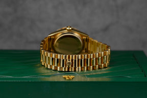 DAYDATE 36MM 18038 YELLOWGOLD CUSTOM DIAMOND & RUBY DIAL DIAMOND BEZEL (WATCH & BOX)